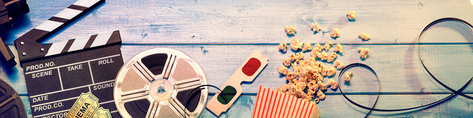film items: clapboard, film reel, popcorn, 3-D glasses