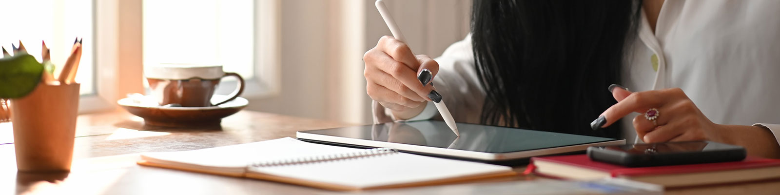 student using tablet pen on mobile device