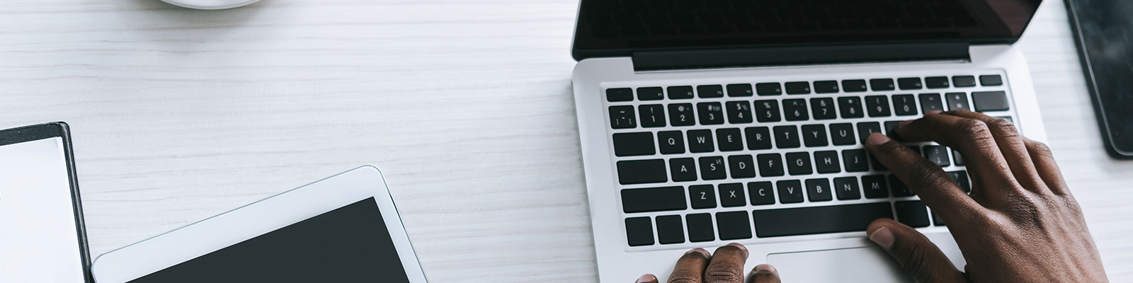 person typing on laptop