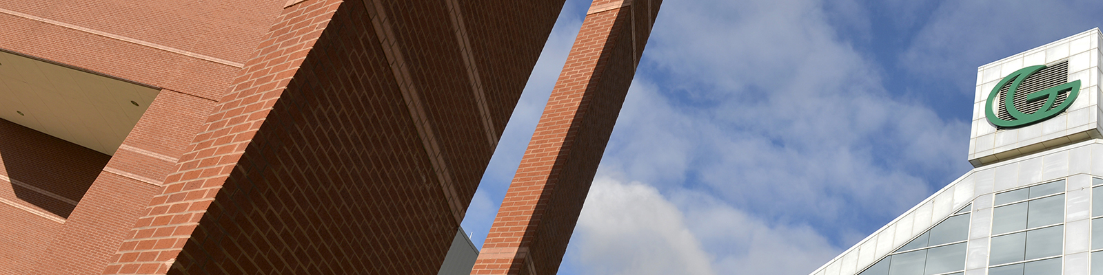 GGC signature building against cloudy blue skies