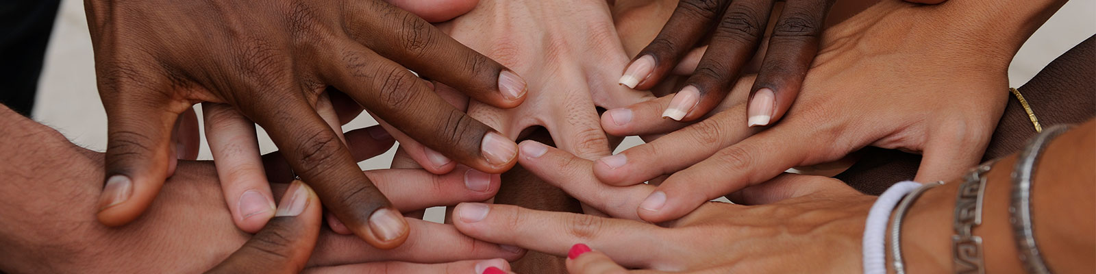 diverse student hands in center circle