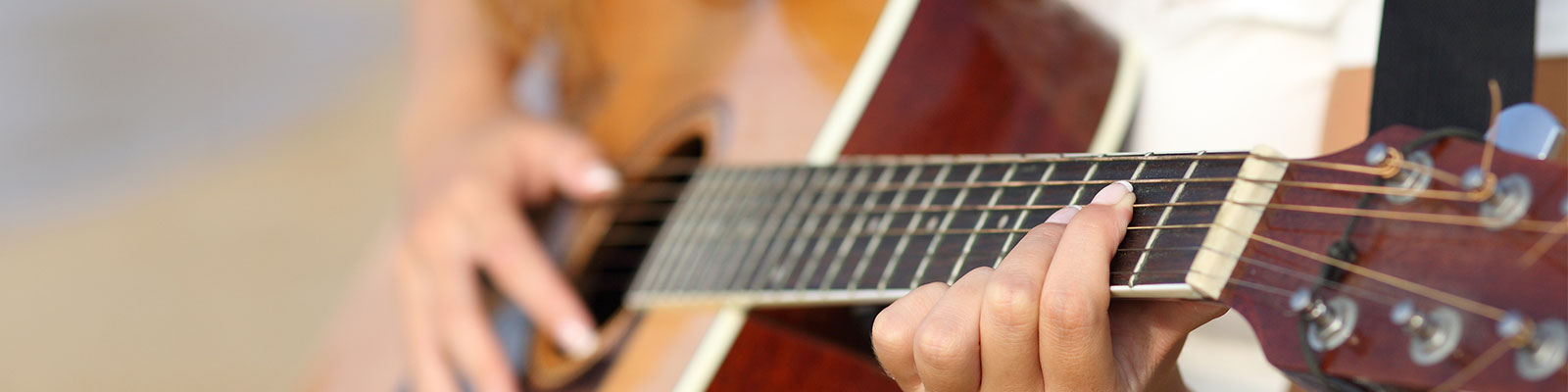 student playing guitar