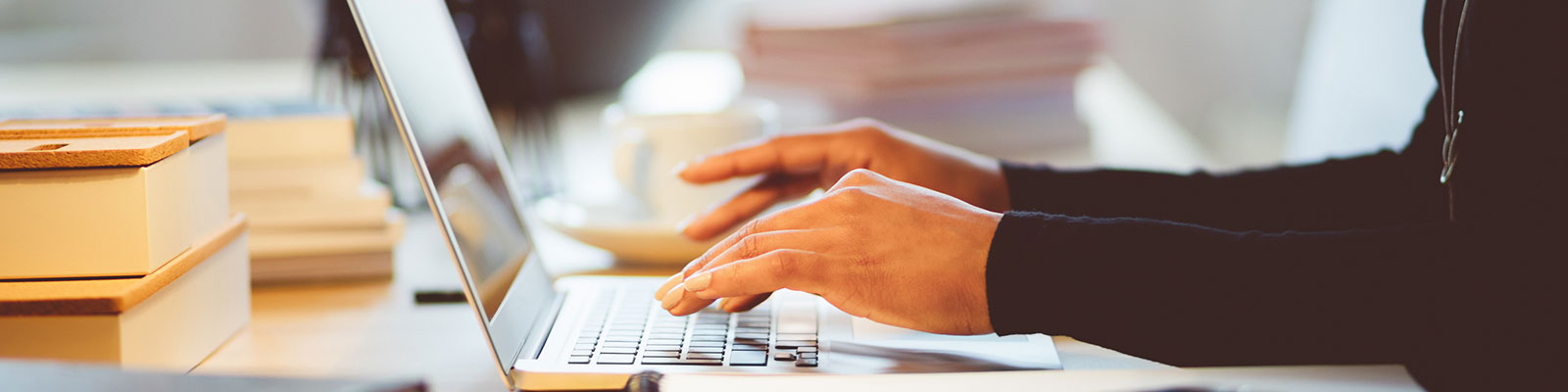 person typing on laptop
