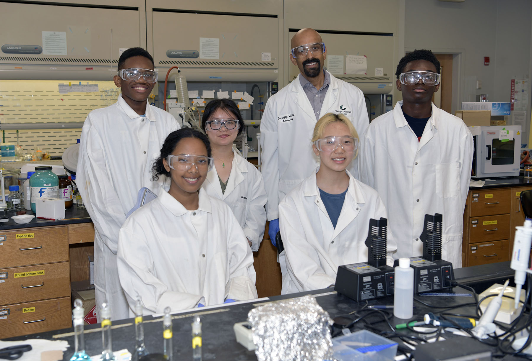 Back row: Malchi McClain and Michelle Diep, Dr. Ajay Mallia and McNelly Tamfor, front row: Galioee Degracig and Joyce Lee.jpg