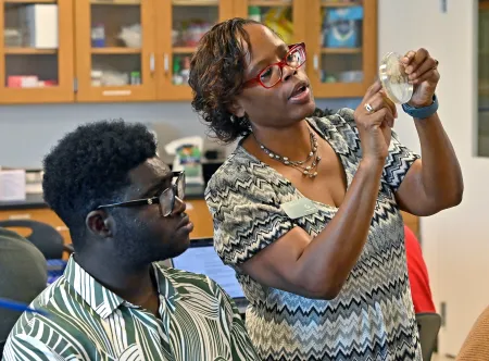 Teacher and student in lab