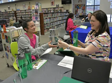 Instant Decision Day at Collins Hill High School, student Lillian Gomez-Dusik and GGC admissions Hannah Chisolm
