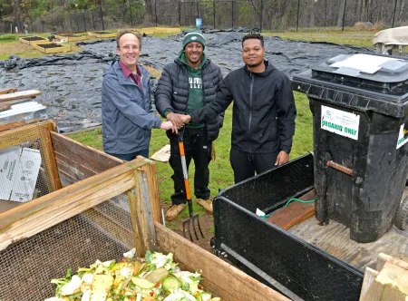 Dr. James Russell and students K.J. Hartfield and Stephen Johnson work together to turn dining hall waste into compost.