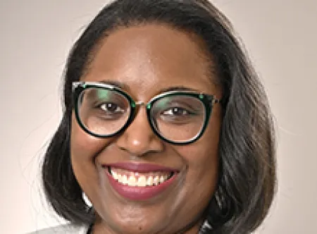Dr. Alesha Harris smiling at camera