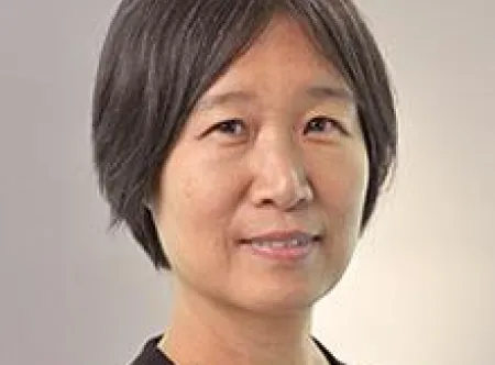 Headshot of Dr. Wenlin Michelle Huang facing at camera and wearing a black top