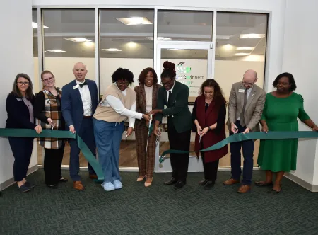 Catherine Downey, Jennifer Paulk, Dr. Matthew Robison, Amanda Ashley, GGC President Dr. Jann Jospeh, David Brown, Nancy Ciudad-Simmons, Dr. Justin Jernigan, Tia Lloyd are all smiles after cutting the ribbon to official open the Belonging Center