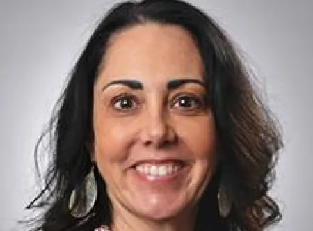 Dr. Rebecca Cooper smiling at camera