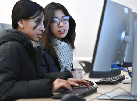 Mai Duong and Nabaa Ahmed collaborate on coding during the Winter 2025 Java Boot Camp