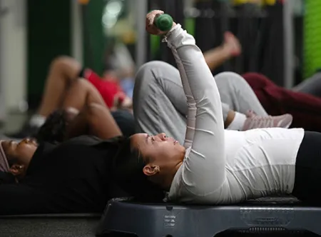 Jazmin Roberts performs a weight press