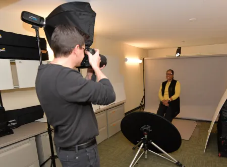 Photographer taking a picture of a staff member