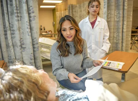 Student talking to a patient