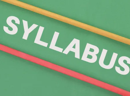 White-lettered word syllabus written on green background with yellow and red stripes