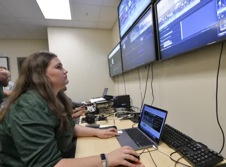 People looking at monitors