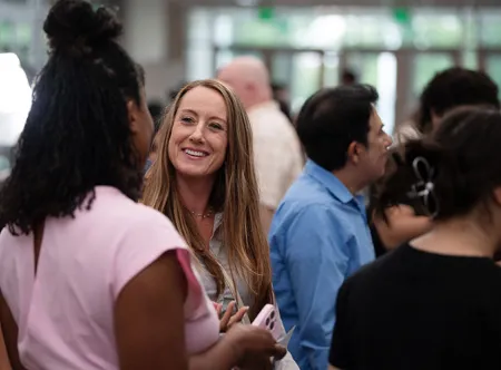 Faculty, alumni and students network during the SBA expo