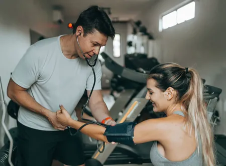 individual administering a blood pressure test