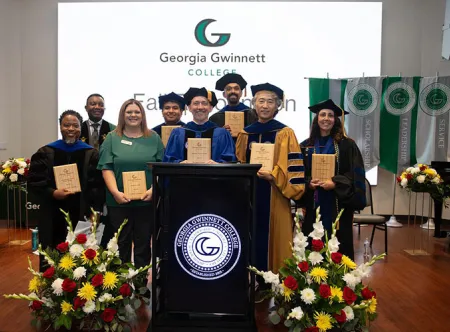 Dr. Damarrio Holloway, Candice Stephens, Dr. Jason Delaney, Dr. Seugjin Lee, Dr. Rebecca Cooper, Dr. Misael Romero-Reyes and Dr. Ajay Mallia pose with their awards and Dr. Joseph Ametepe after the Fall Recognition 2025 ceremony