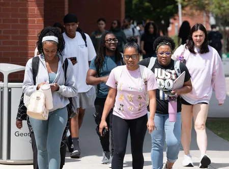 busy campus with lots of students heading to their next class