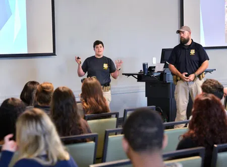 GBI agents speaking with students studying criminal justice