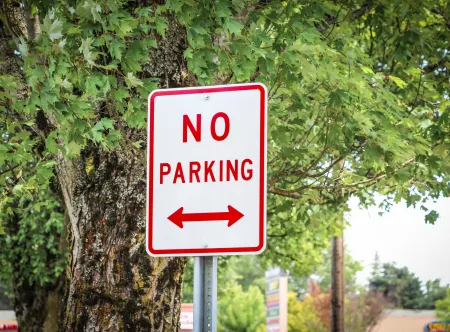 red and white no parking sign