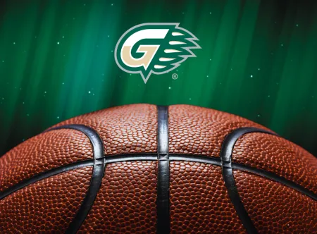 GGC Athletics G-Claw logo landscape with half of a basketball below the logo, all on a dark green background