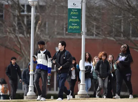 Group of GGC students walking between classes on campus