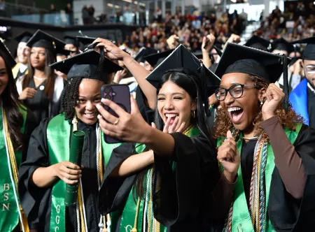 Group photo of fall 2025 commencement graduates in the GGC Convocation Center