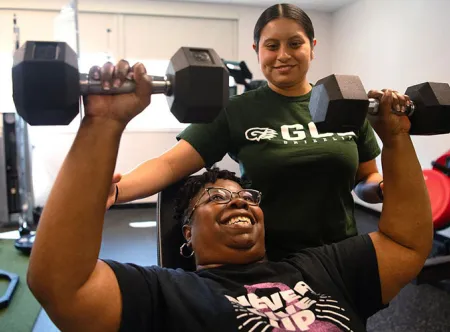 Zulaykha Lemus-Vazquez spots Laura Taylor as they work out during the Free Fitness Program
