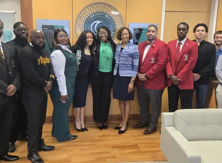 President Jann Joseph poses with student members of Georgia Gwinnett College's on-campus Greek organizations in the presidential suite