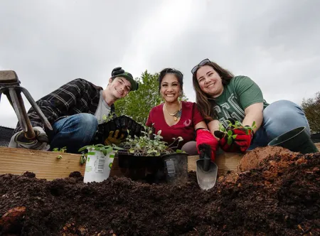 GGC students planting in the on-campus microfarm