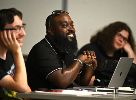 three engaged student with smiles during class