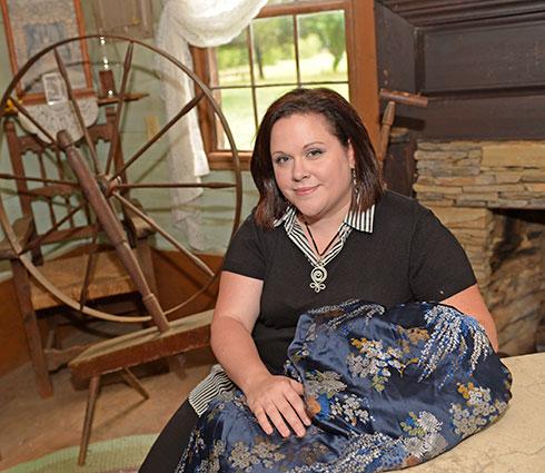 History student with textile at historical site