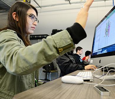 Student developing 3D imaging in computer lab