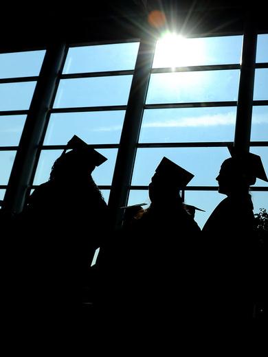 Silhouetted graduates