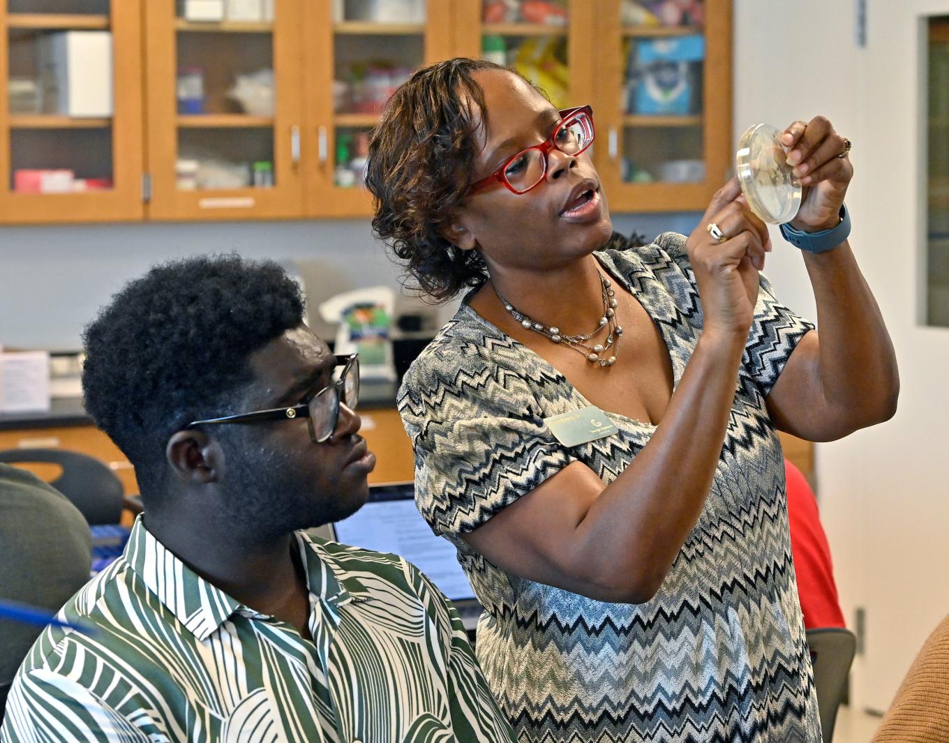 Teacher and student in lab