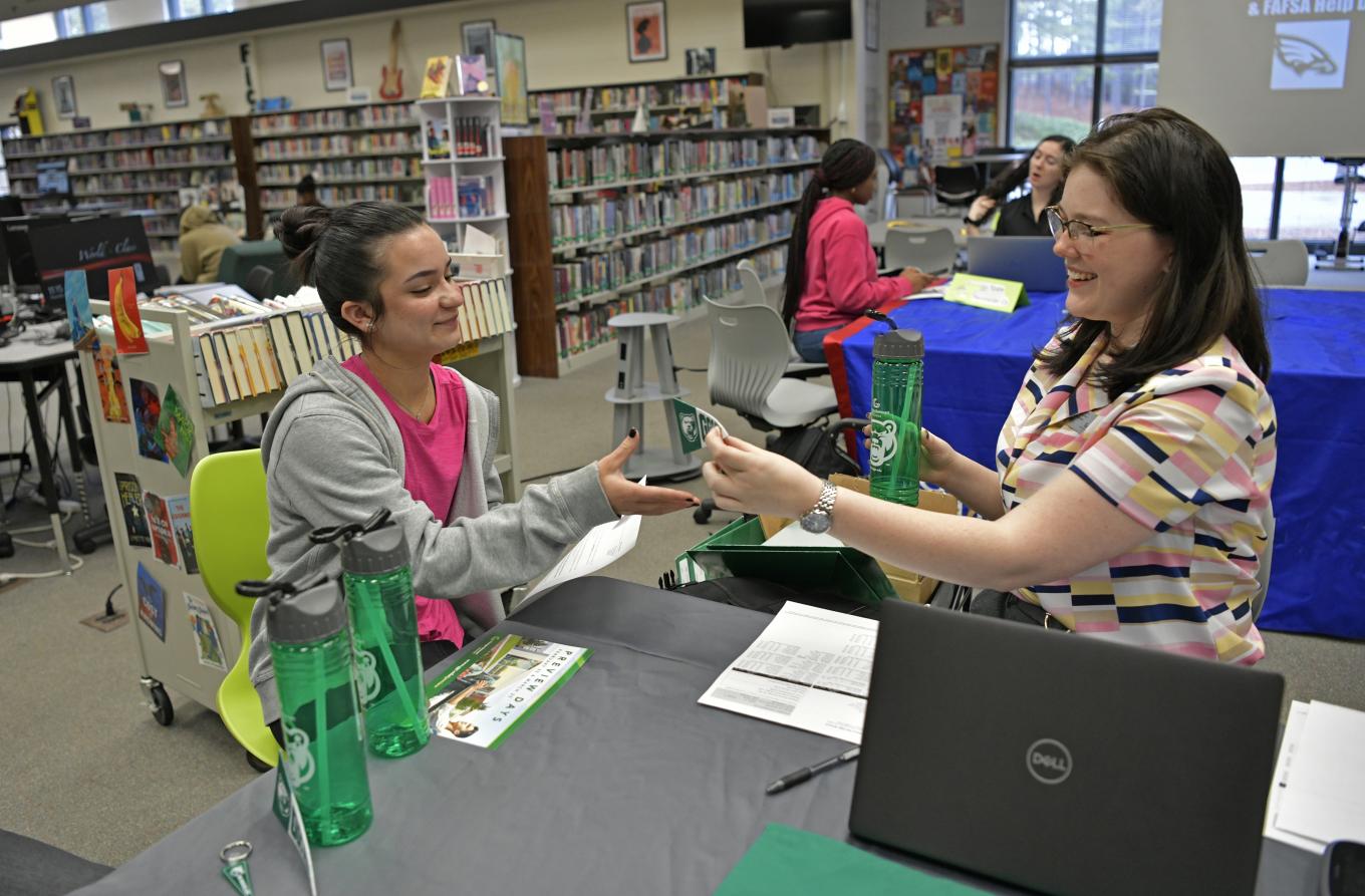 Instant Decision Day at Collins Hill High School, student Lillian Gomez-Dusik and GGC admissions Hannah Chisolm