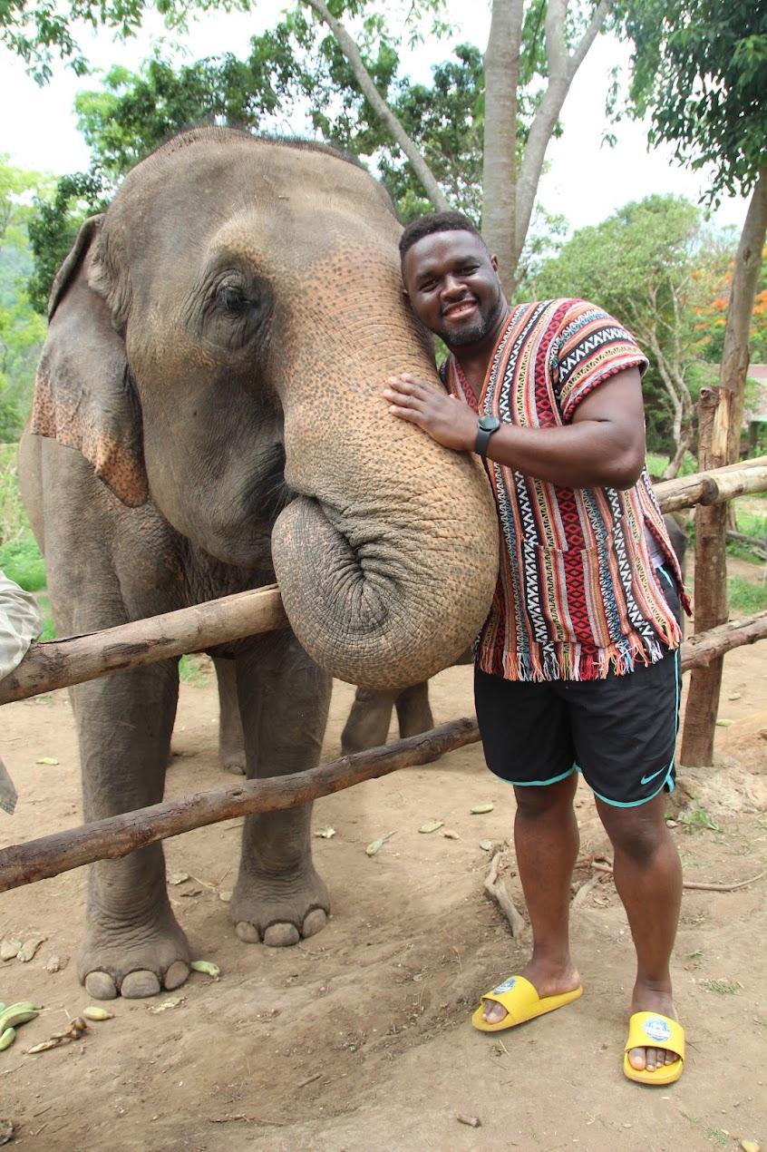 Dr. Neville Forlemu visits an elephant sanctuary in Thailand.