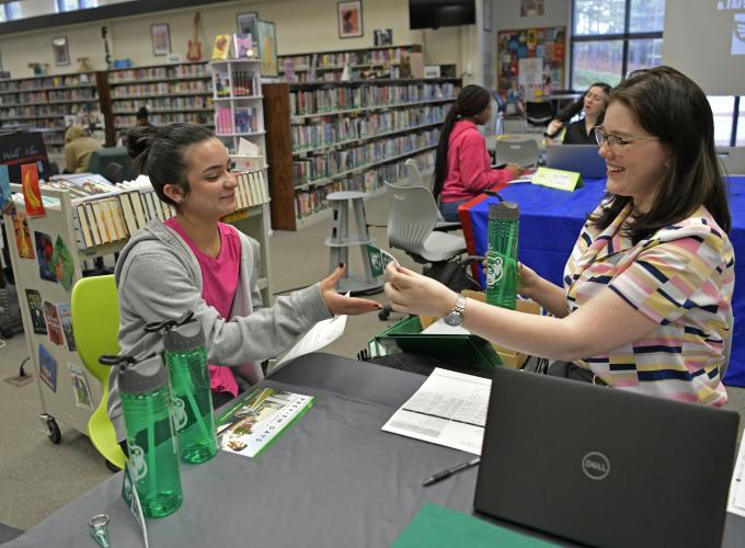 Instant Decision Day at Collins Hill High School, student Lillian Gomez-Dusik and GGC admissions Hannah Chisolm