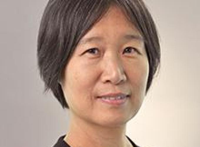Headshot of Dr. Wenlin Michelle Huang facing at camera and wearing a black top