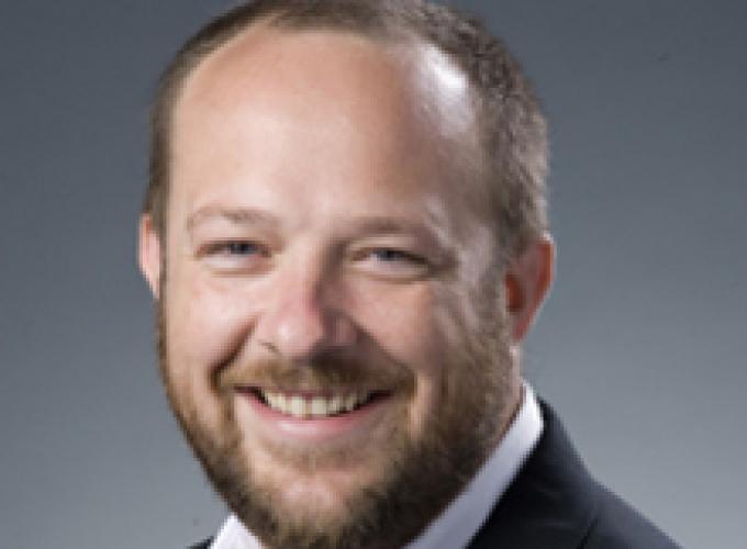 Dr. Marc Gilley smiling at camera