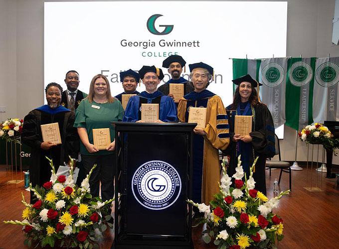 Dr. Damarrio Holloway, Candice Stephens, Dr. Jason Delaney, Dr. Seugjin Lee, Dr. Rebecca Cooper, Dr. Misael Romero-Reyes and Dr. Ajay Mallia pose with their awards and Dr. Joseph Ametepe after the Fall Recognition 2025 ceremony