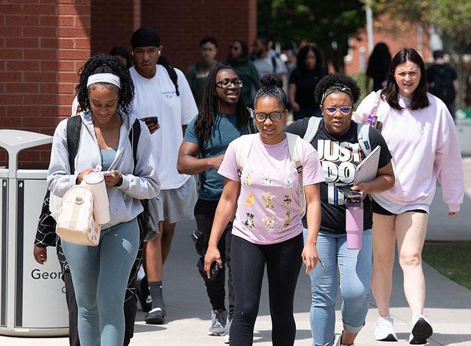 busy campus with lots of students heading to their next class