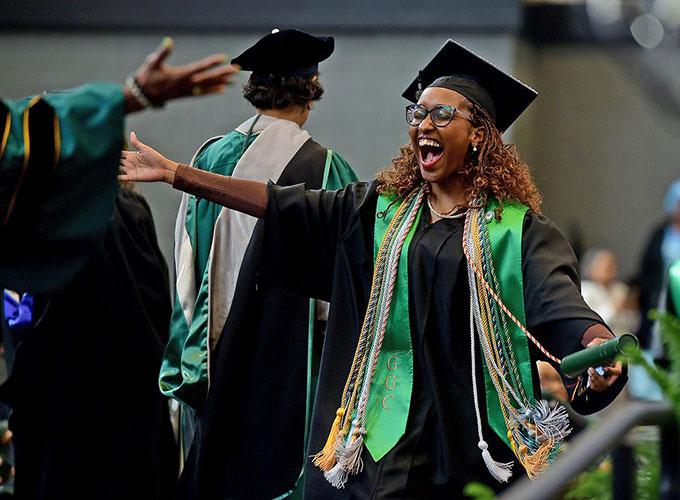 Nursing student Prudence Donald celebrates during the fall commencement