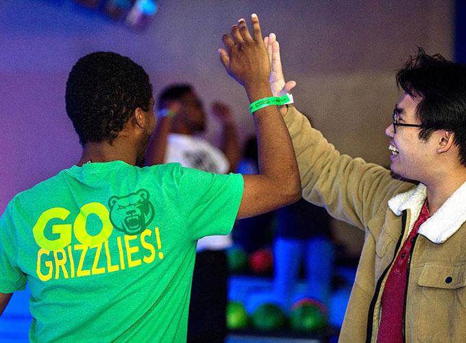GGC students "high-fiving" during bowling event