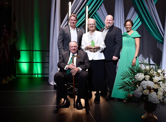 Clyde and Sandra Strickland, their two sons and Dr. Jann Joseph posing for a picture on the stage at the GGC Four Pillars Scholarship Gala