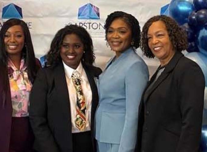 President Jann L. Joseph and Lakeisha Hill takes photo with Gwinnett County Chairwoman Nicole Love-Hendricksonwoman and Capstone Solutions president Tina Woodard