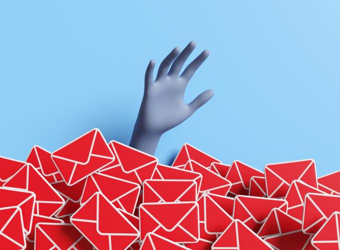 Human hand raising above a heap of red mails on light blue background. Illustration of the concept of email overload and enormous unread messages